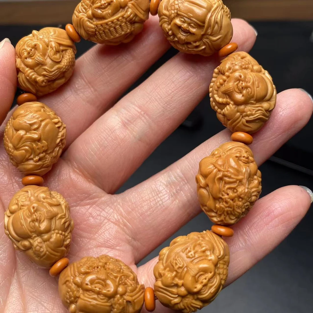 橄榄核核雕手串齐横竖龙财