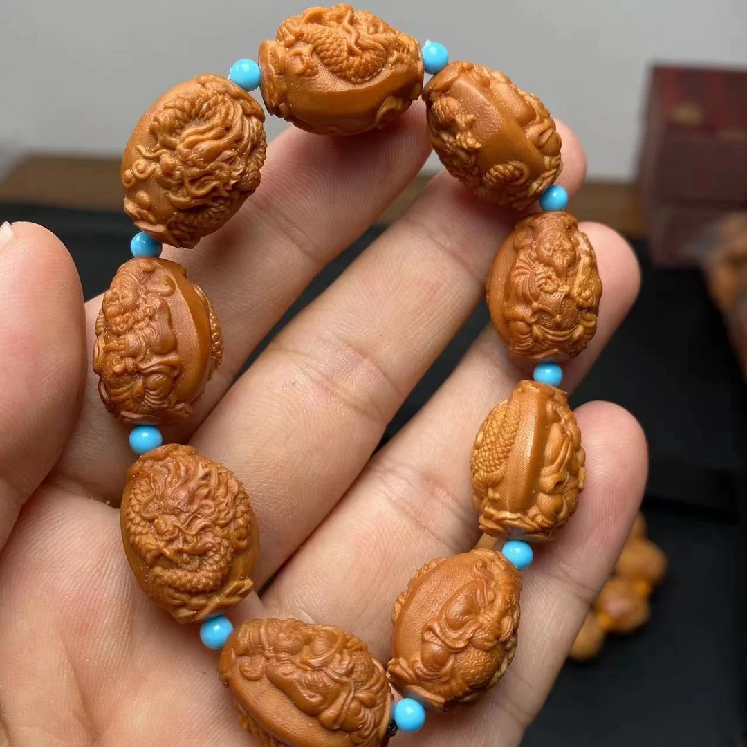 橄榄核核雕手串许九龙财神