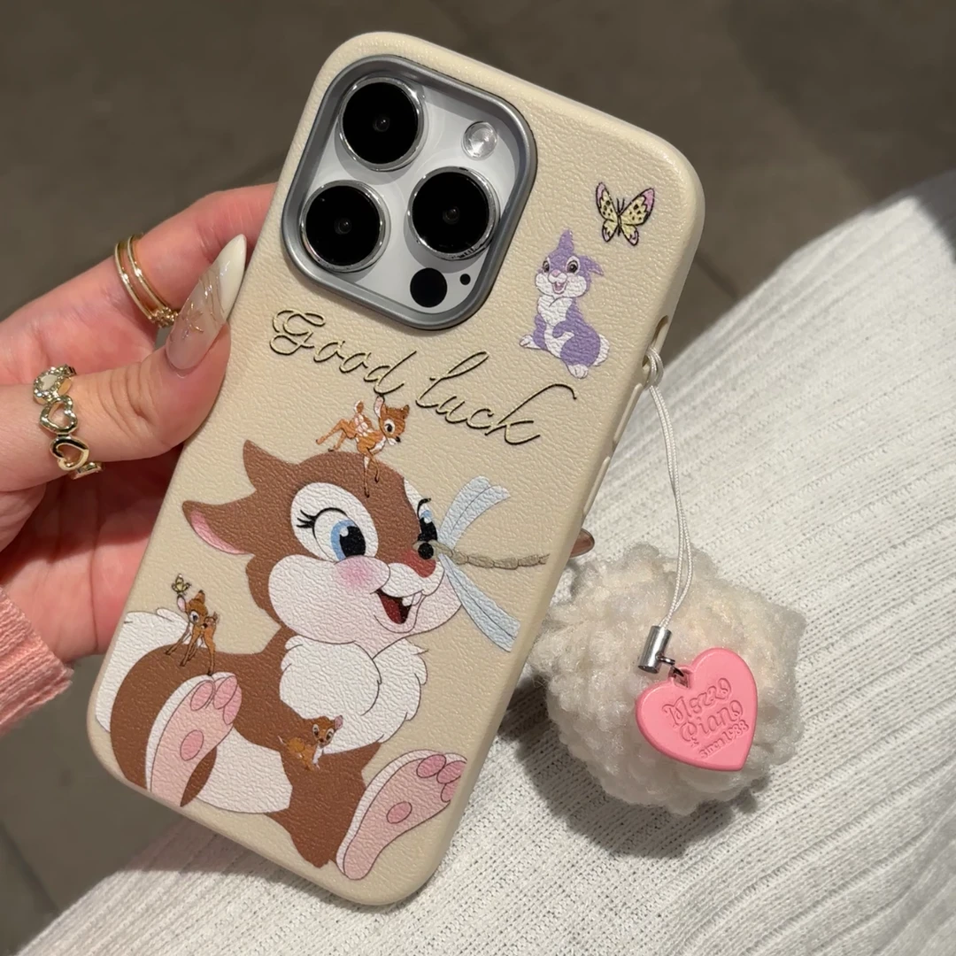 欧克里里桑普兔斑比适用苹果16白毛球手机壳15/14皮纹金属框13/12