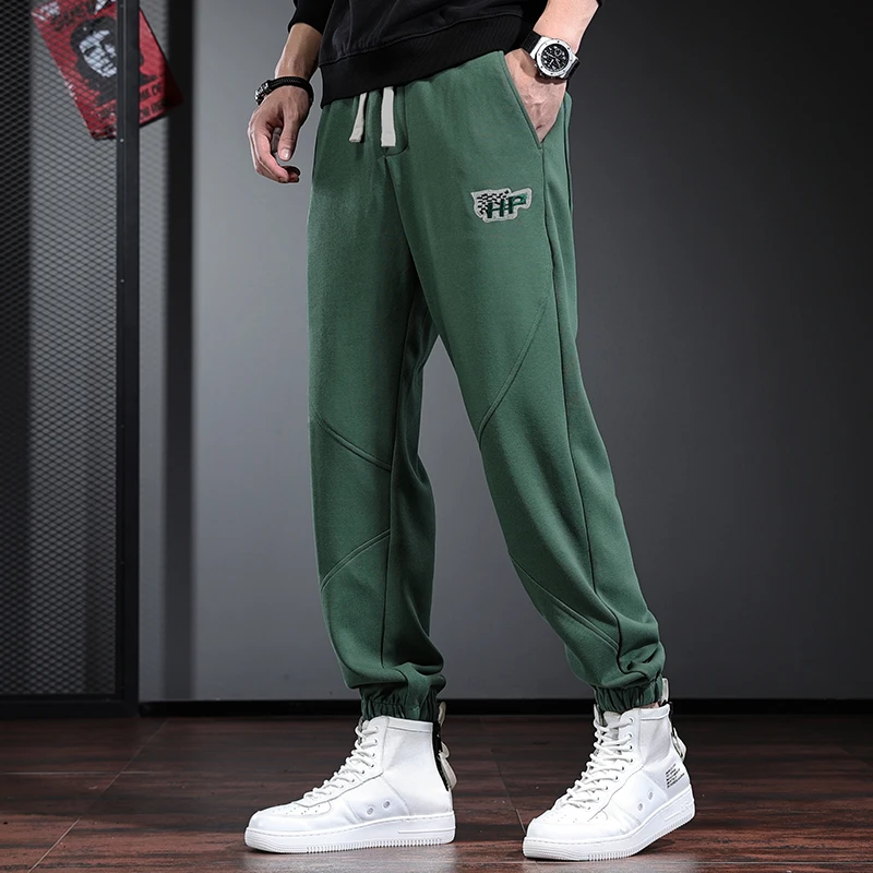 军绿色裤子男潮牌宽松运动裤秋冬季垂感束脚哈伦裤弹力休闲卫裤