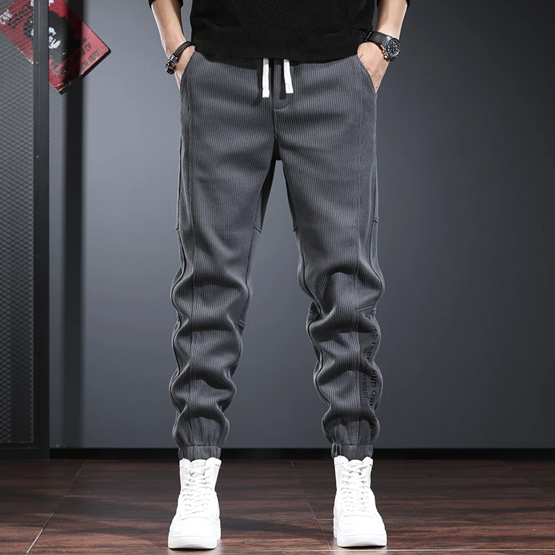 秋冬款休闲裤男潮牌宽松束脚裤时尚百搭灰色大码松紧腰青年卫裤男