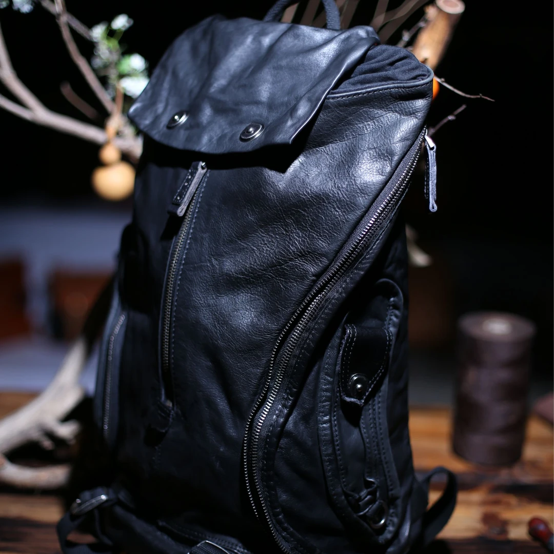 潮品暗黑风真皮男士双肩包洗水做旧软皮休闲女背包街头风中性黑色