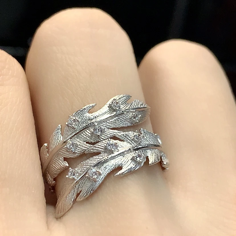 925银合成锆石戒指 高级感电白款白锆羽毛上开口戒指