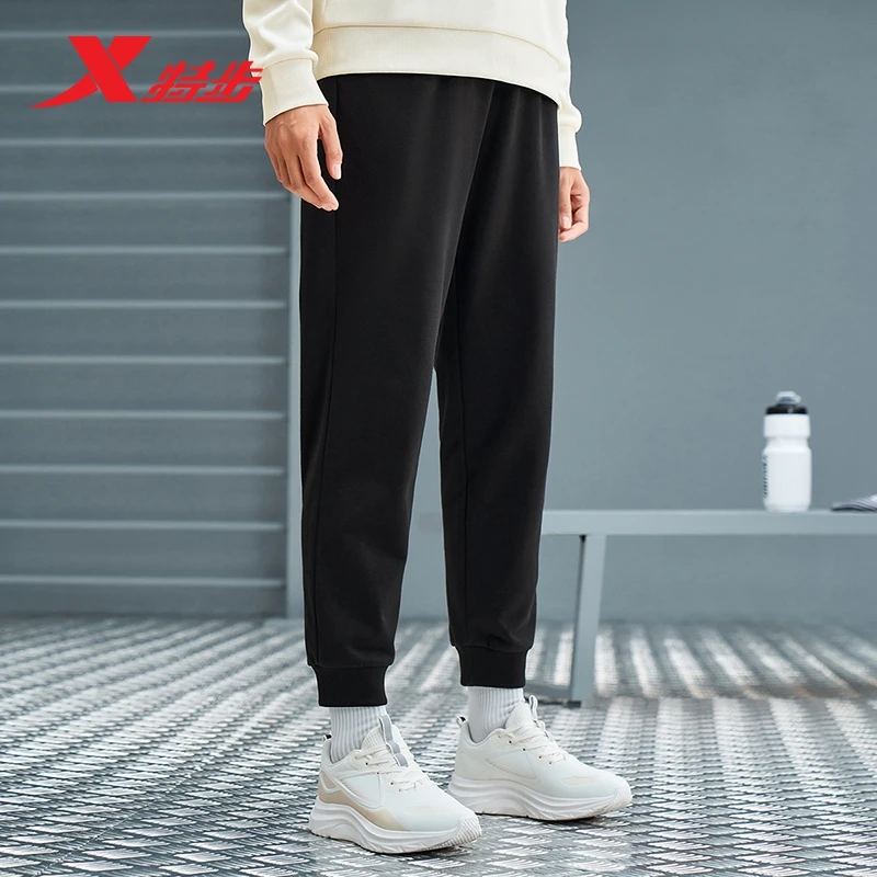 特步加绒卫裤2025秋冬款针织女士休闲舒适束脚弹力女子运动裤