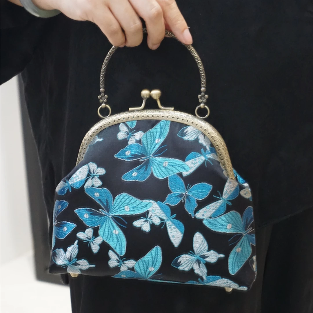 复古国风黑底蓝蝴蝶织锦缎中式百搭手提布艺包旗袍连衣裙搭配