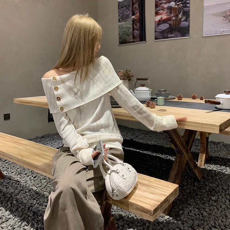 TA suki【烟岚】mv女主入魂 渲染感针织一字肩上衣优雅气质小众女