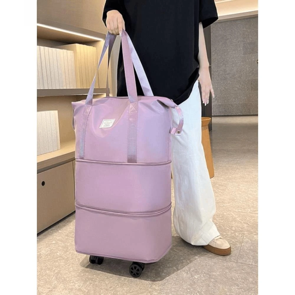 乌鲁木齐发货点砚带万向轮的旅行包旅游收纳袋可折叠行李箱女轻便