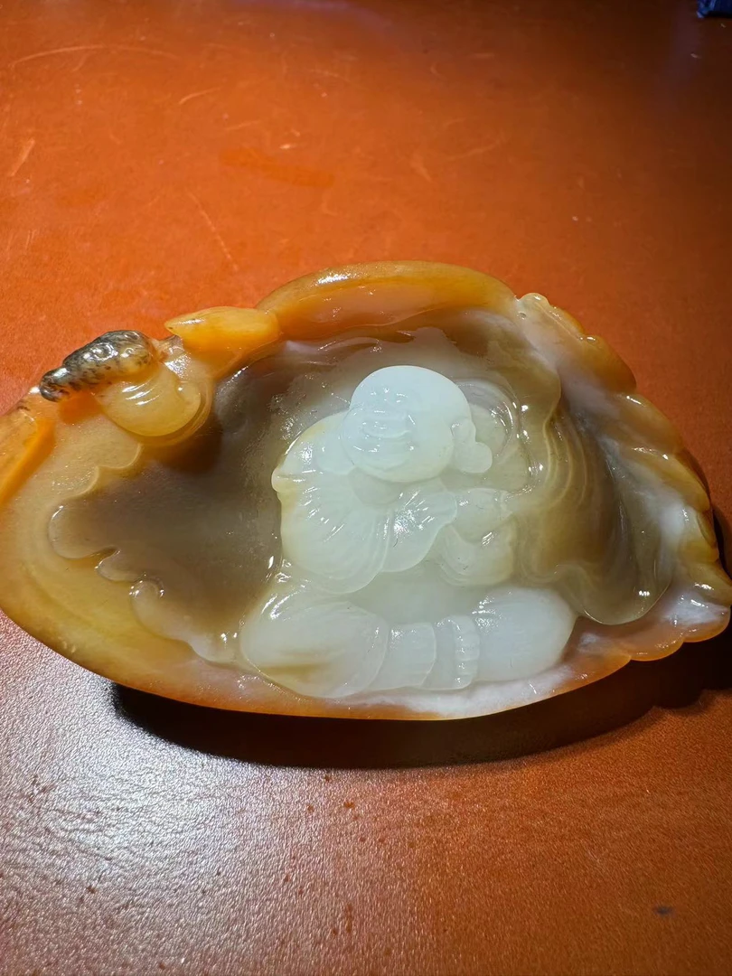 新疆和田玉手把件佛