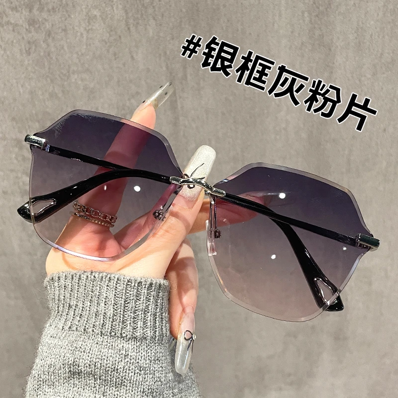 时尚气质女士太阳眼镜网红时尚百搭防紫外线无框渐变灰粉墨镜女潮