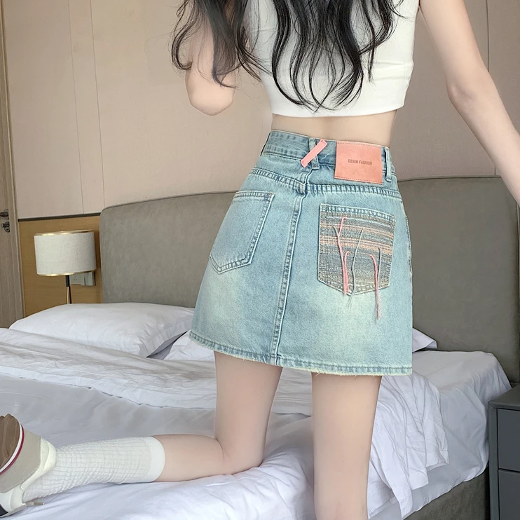 夏季显瘦高腰包臀撞色牛仔超短裙设计感流苏防走光a字刺绣手工口