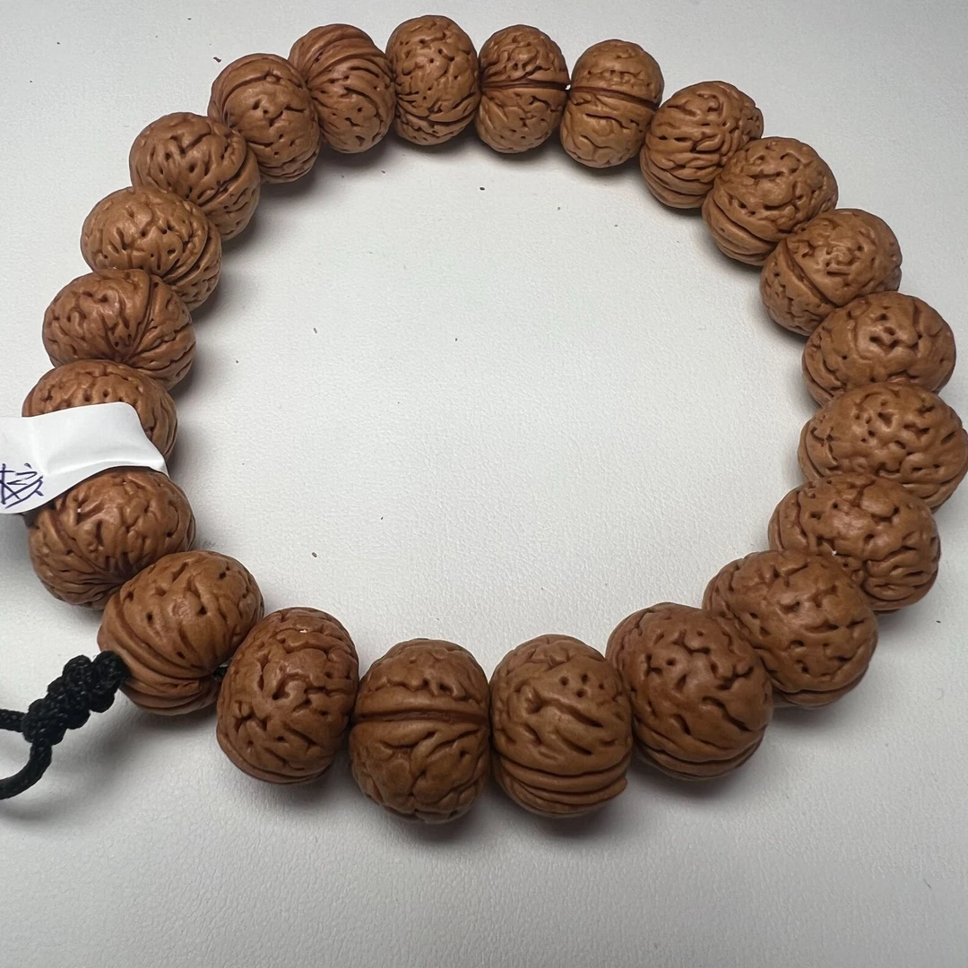 精品原皮桃核手串（大纽扣）