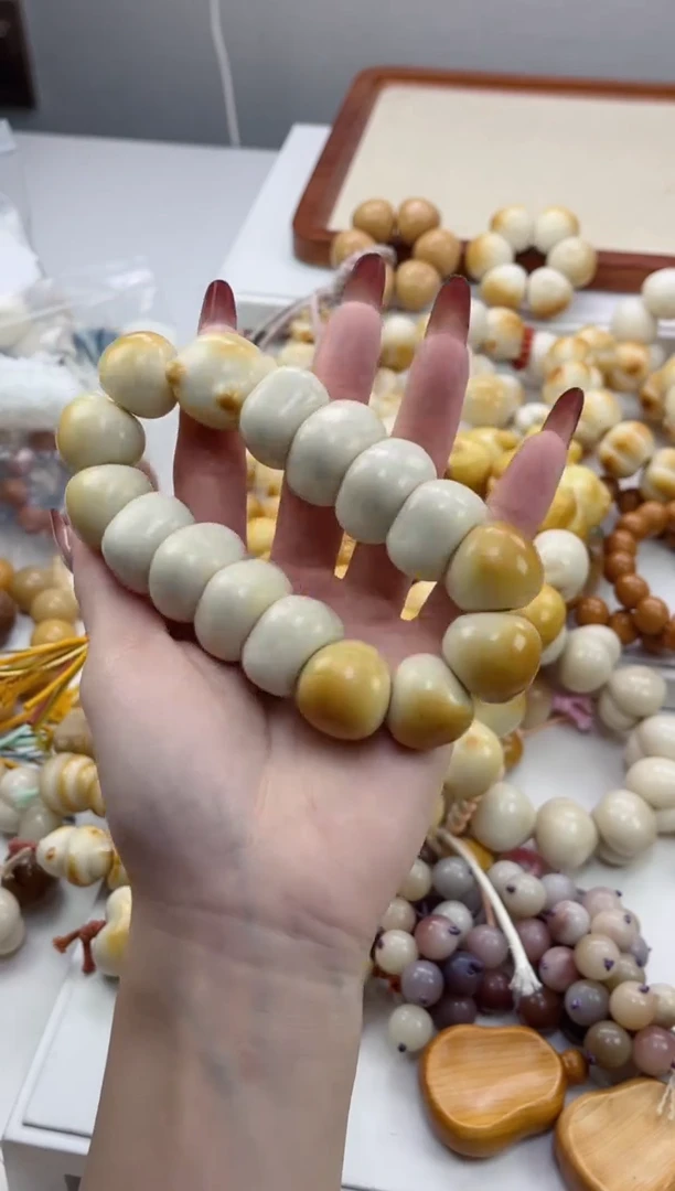 手串菩提根/象牙果象牙果猫头溏心蒜瓣藏扣20mm手持