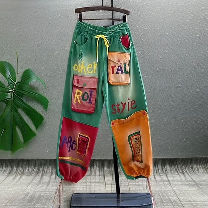 今年流行新款春季个性高腰显瘦牛仔裤女松紧腰彩绘水洗束脚工装裤