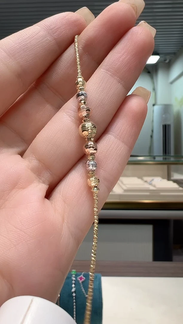 手链18K金杭****发三色镭射珠手链