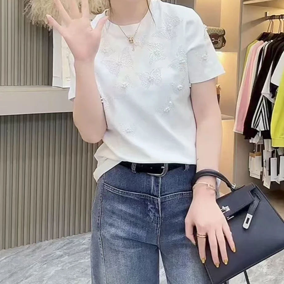 90046-Q-韩版设计感重工烫钻钉珠立体蝴蝶女装弹力坑条大码半袖衫