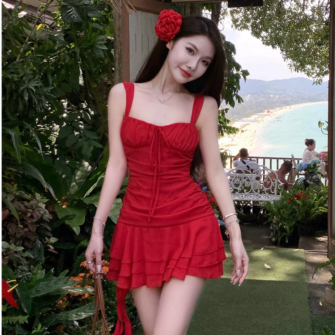 不规则海边度假小红连衣裙夏季2025新款高端气质性感包臂纯欲裙子