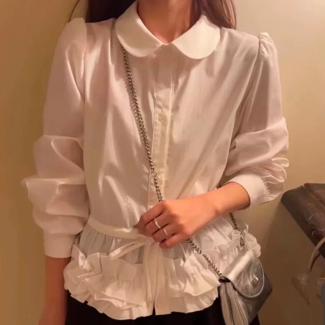 蓬松花瓣下摆衬衫2025新款春季压褶白色花边娃娃领长袖衬衣