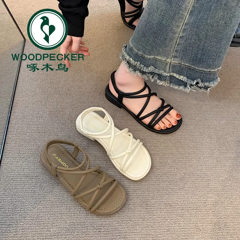 啄木鸟平底细带凉鞋女夏2025新款外穿网红踩屎感仙女配裙子罗马鞋