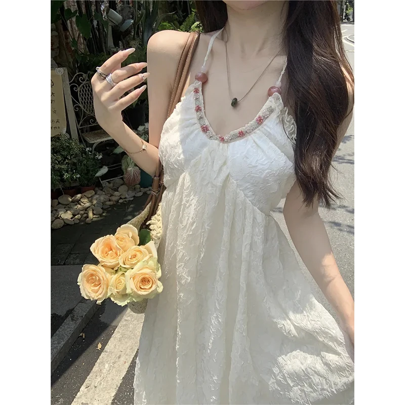 纯欲风大露背挂脖吊带连衣裙女夏季新款设计感修身显瘦绑带长裙
