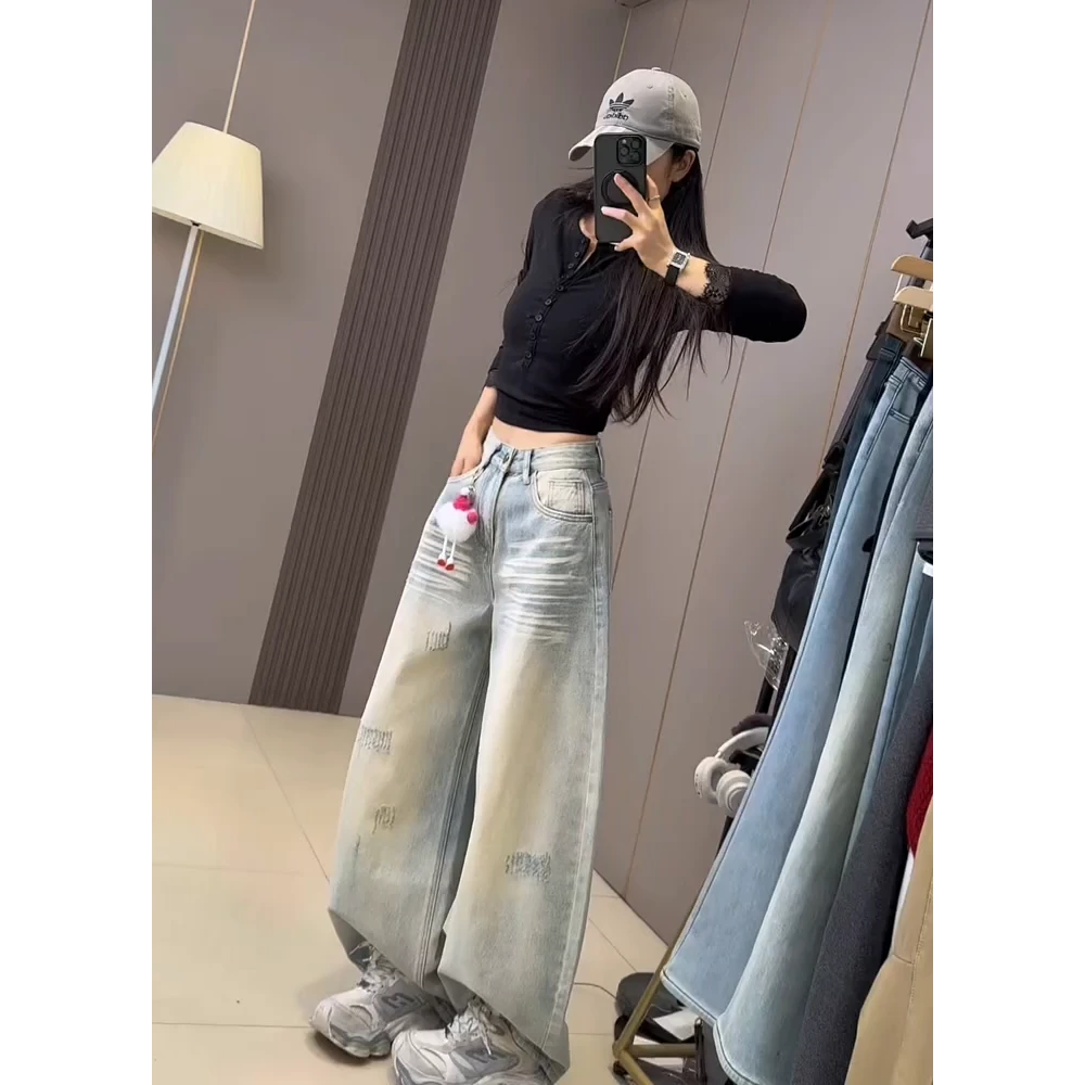 设计感复古水洗破洞牛仔裤女2026春秋新款垂感宽松显瘦弯刀阔腿裤