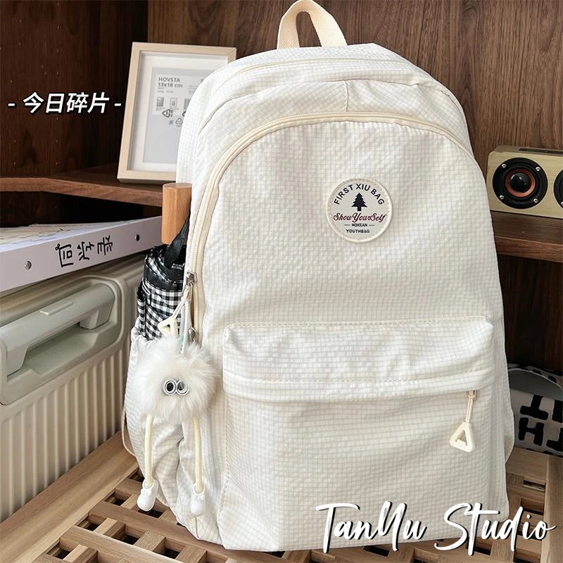 探屿大容量书包女生初中小众设计感大学生纯色高中生简约双肩包