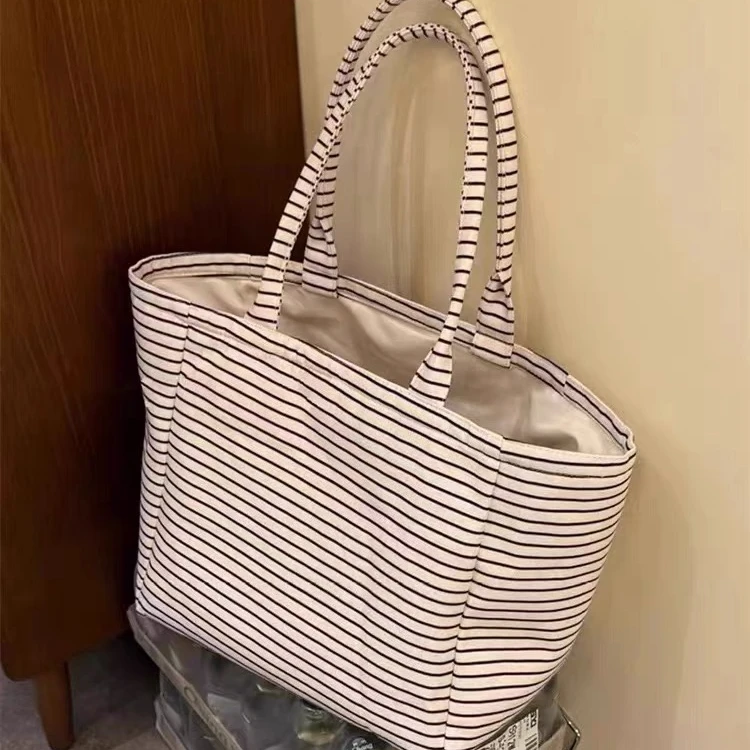 文艺百搭小众手提托特包2025新款简约大容量通勤条纹包单肩腋下包