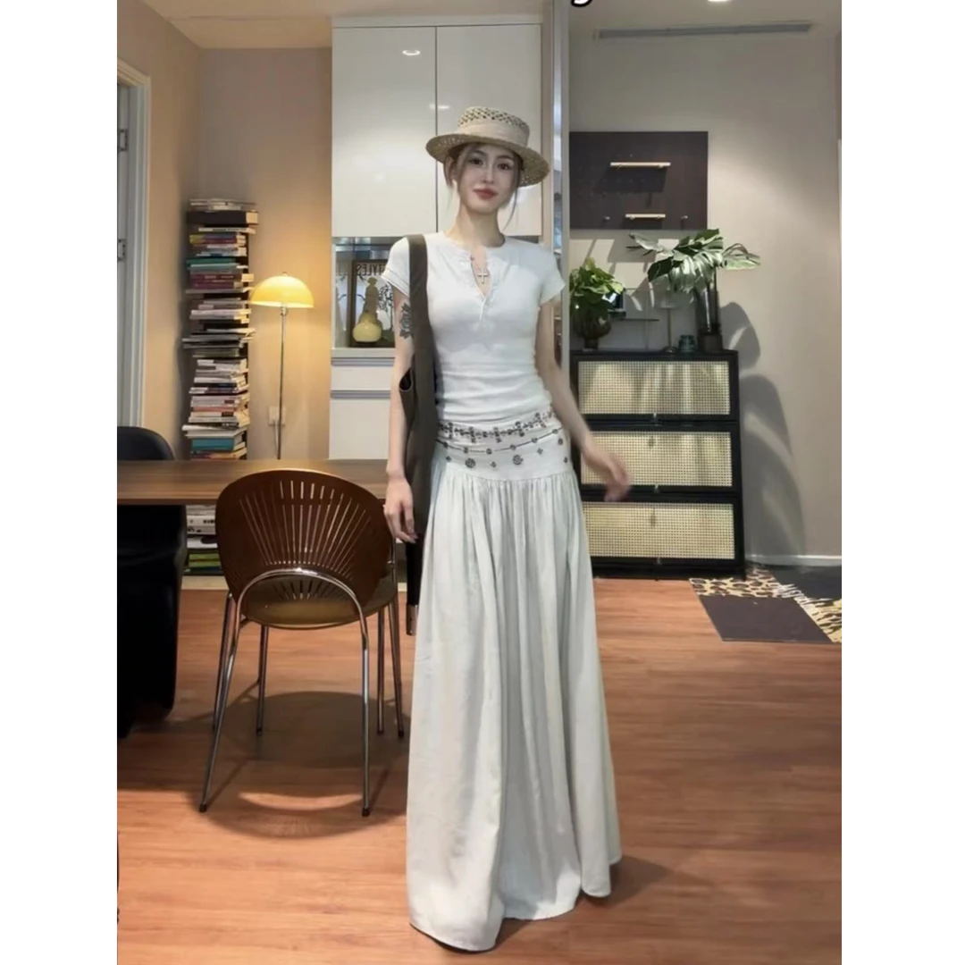 法式度假风休闲百搭半身裙女夏季新款气质辣妹低腰显瘦大摆长裙