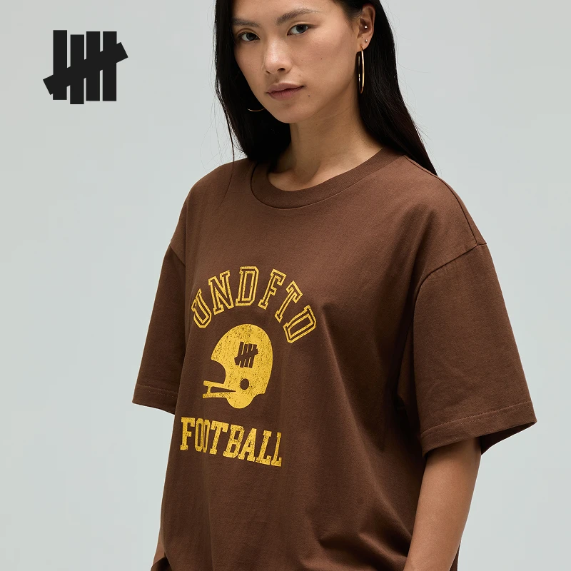 UNDEFEATED五条杠新品美式橄榄球头盔主题男士t恤短袖UC52GSS14M