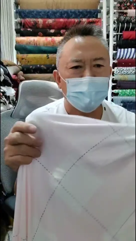 奶白粉色线条格子布料