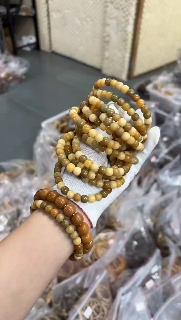 手串菩提根/象牙果7*8机抛奶豆子（806）