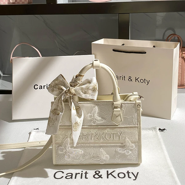 CARIT KOTY小众蕾丝托特包包女爆款2025新款潮蝴蝶通勤手提斜挎包