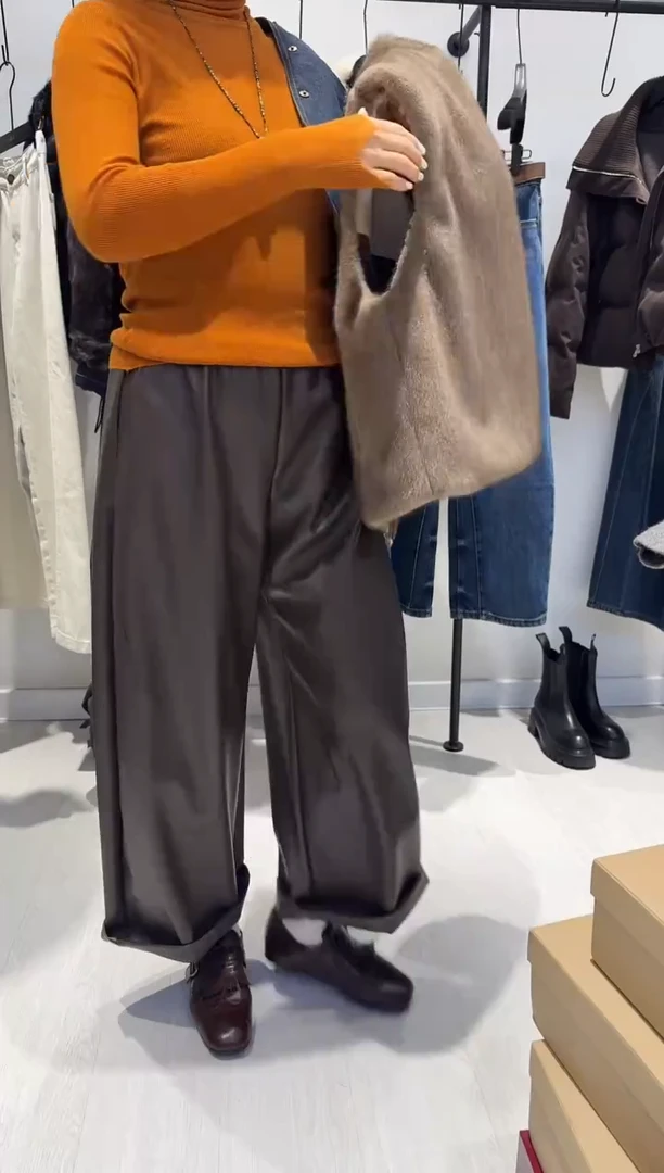 咖啡色皮裤设计师款