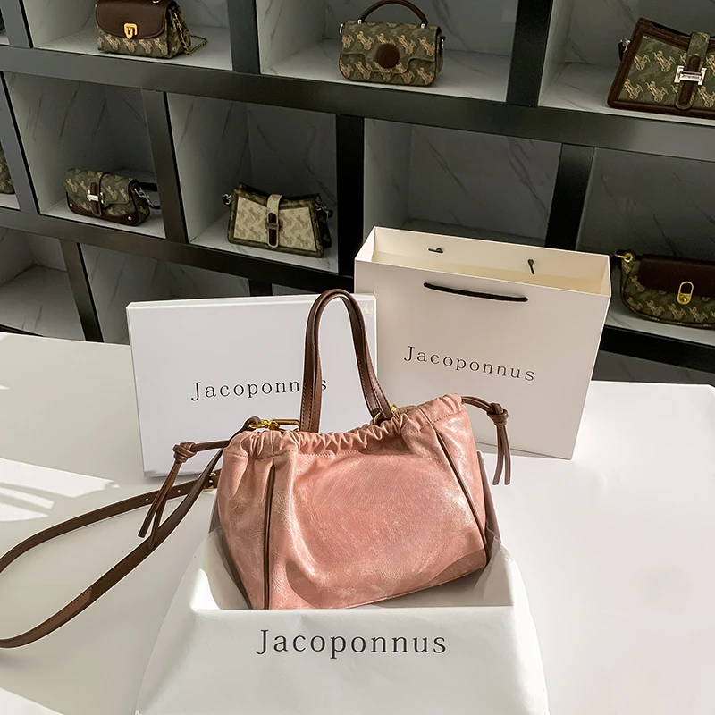 真皮粉色凯旋门托特包女2024新款秋天轻奢高级感小众大容量水桶包