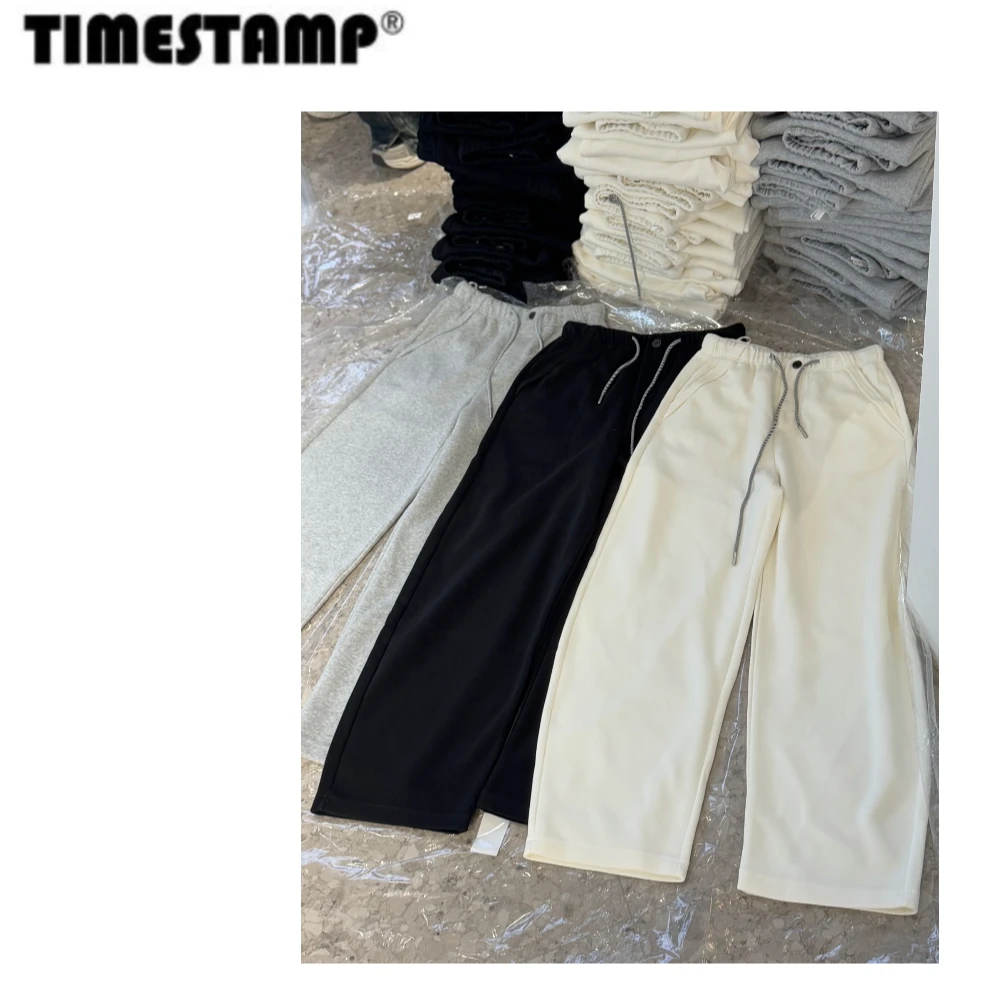 【TIMESTAMP】2025/681801早春新款时尚简约百搭款一扣抽绳弯刀卫裤