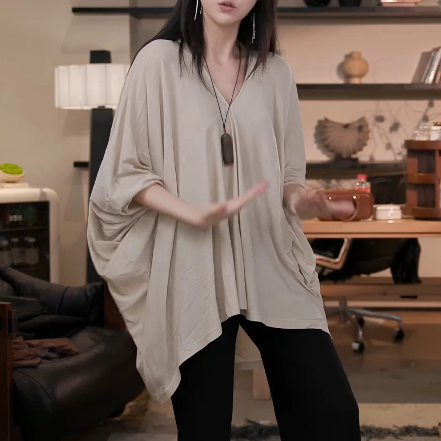 张七七春秋长袖薄款宽松纯色针织衫女2025百搭不规则打底衫
