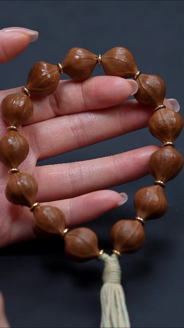 橄榄核手串1.6素串蜜桃臀