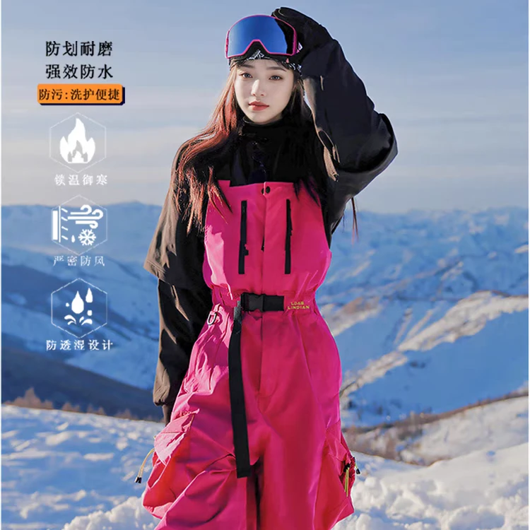 玫红色滑雪工装背带裤女2025冬季新款小众防风防水情侣单板滑雪服