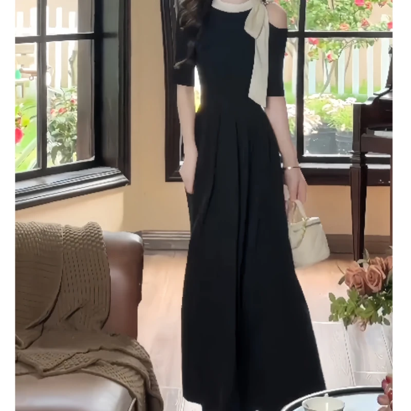 夏季优雅千金风黑色小黑裙蝴蝶结露肩圆领短袖连衣裙法式赫本长裙