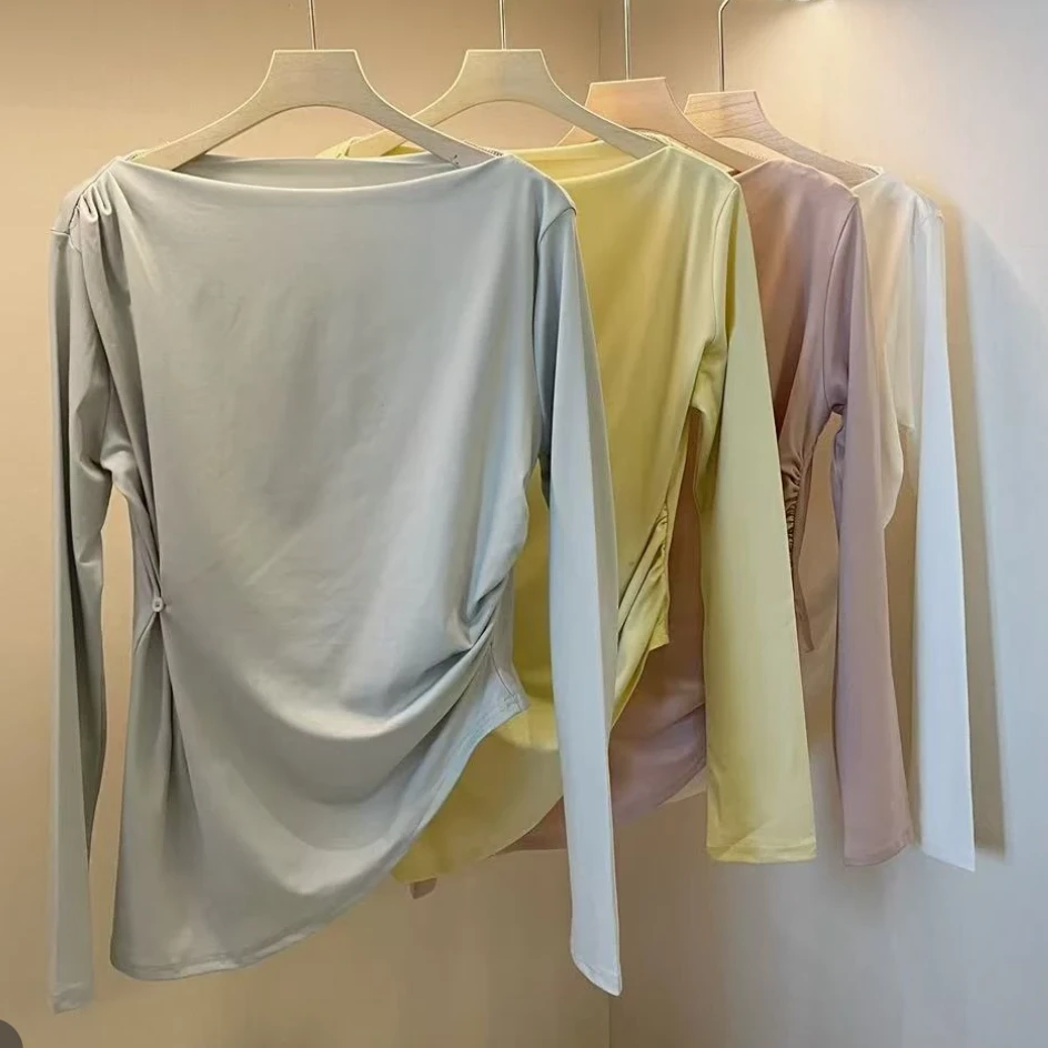 纯欲修身一字肩长袖T恤不规则上衣2025新款春时尚纽扣设计感气质