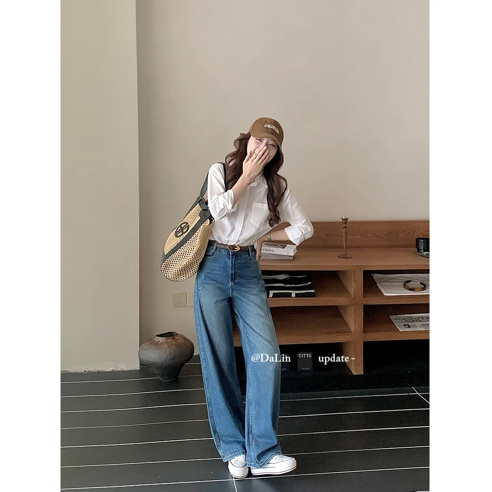 早秋新款设计感高腰牛仔裤女宽松显瘦显腿长复古百搭窄版弯刀裤