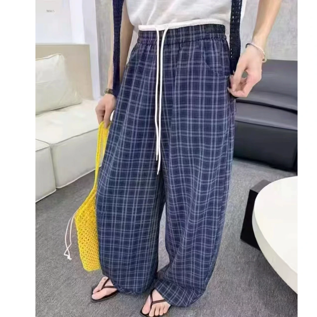 初秋新款时尚休闲格子弯刀裤.250140