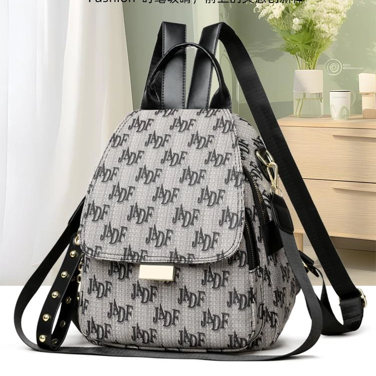 2069休闲斜挎包字母多功能时尚百搭包盖式新款轻便旅行洋气双肩包