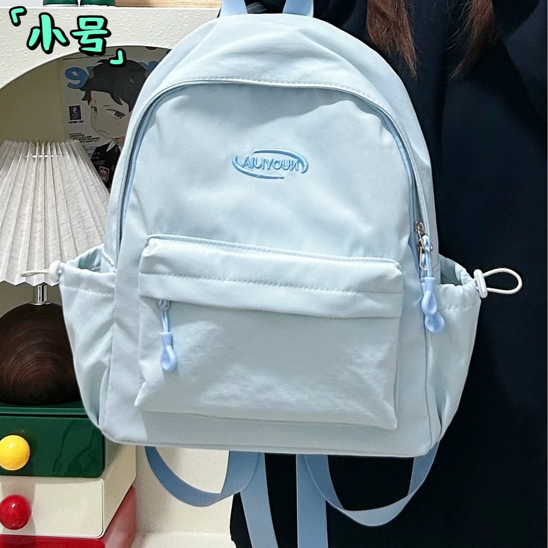 白搭通勤双肩包通用简约风休闲风纯色拉链书包小学生双肩背高中生