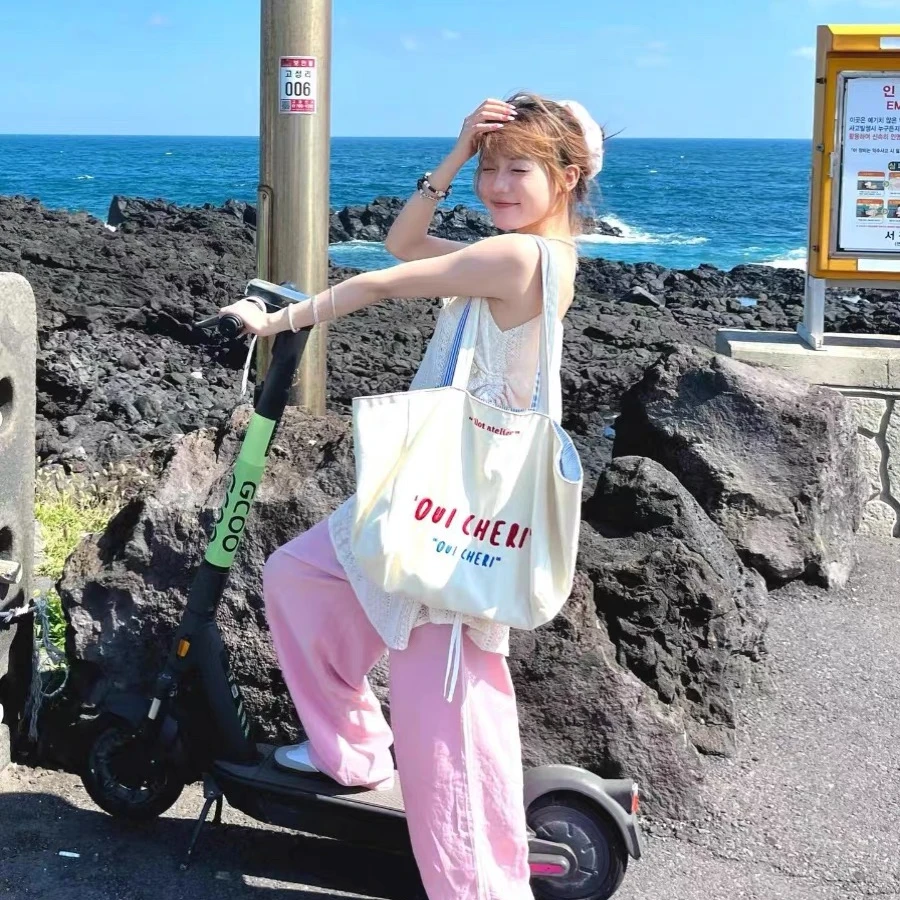 韩版小众设计字母帆布包女2025新款复古通勤百搭大容量单肩托特包