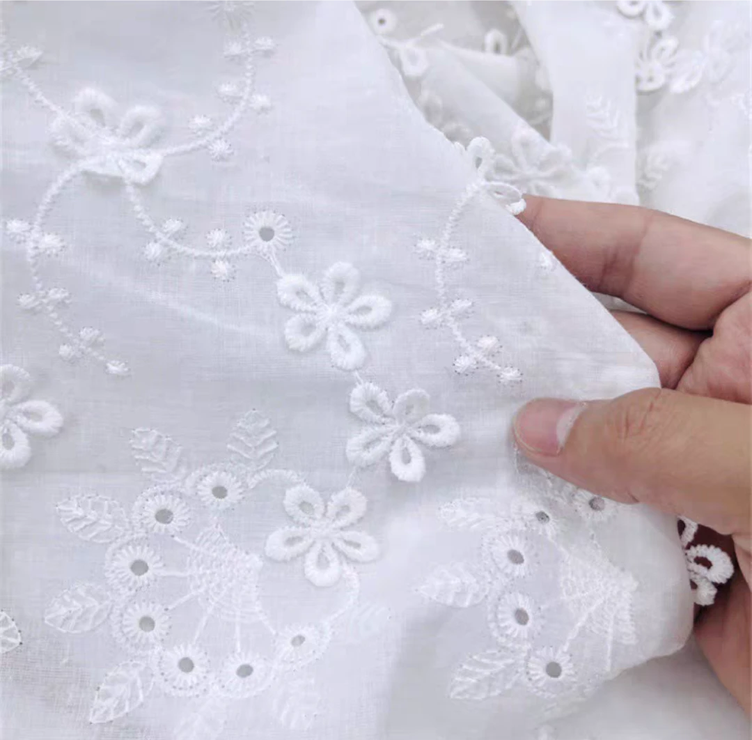 现货全棉镂空绣花布白色棉布双边刺绣服装连衣裙蕾丝绣花面料布料