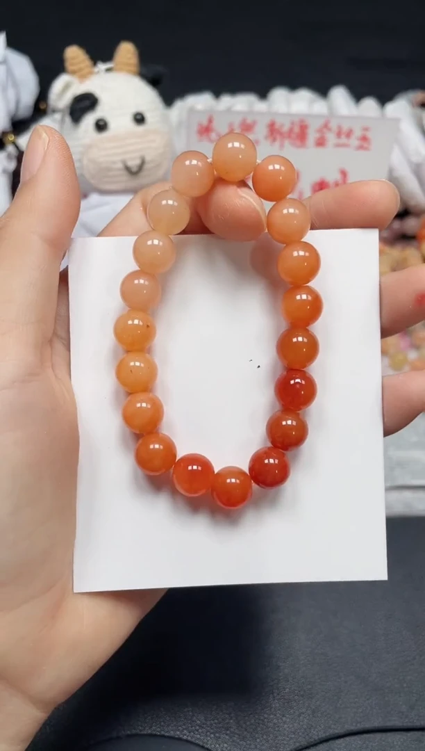 【闪购商品】石英质玉手链未镶嵌柿子红卡10