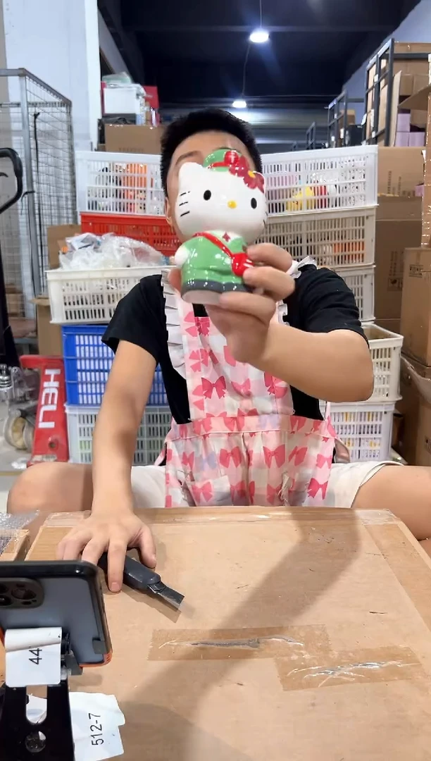 瓷片绿色kt猫邮递员存钱罐