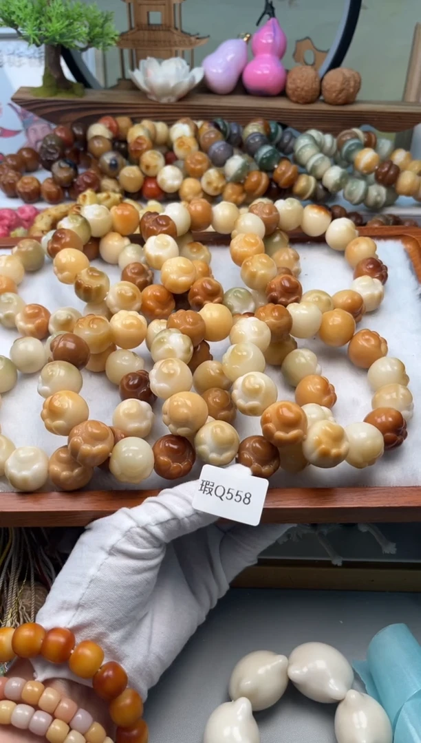 【闪购商品】菩提根/象牙果手串瑕q558爱心猫爪20mm一串随机