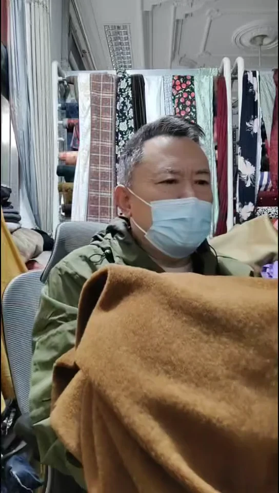 深咖橘色雪花针织布料