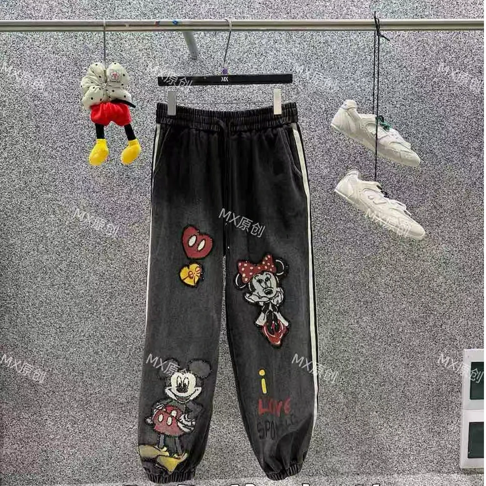 春款时尚休闲黑色宽松破洞印花重工春款时尚休闲黑色宽松破洞裤子